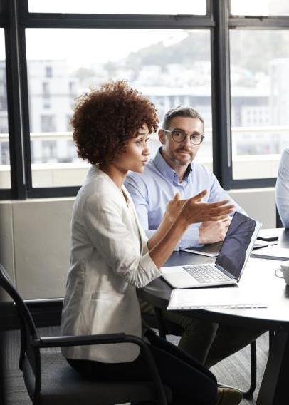 Divers group of five adults sitting around a conference table